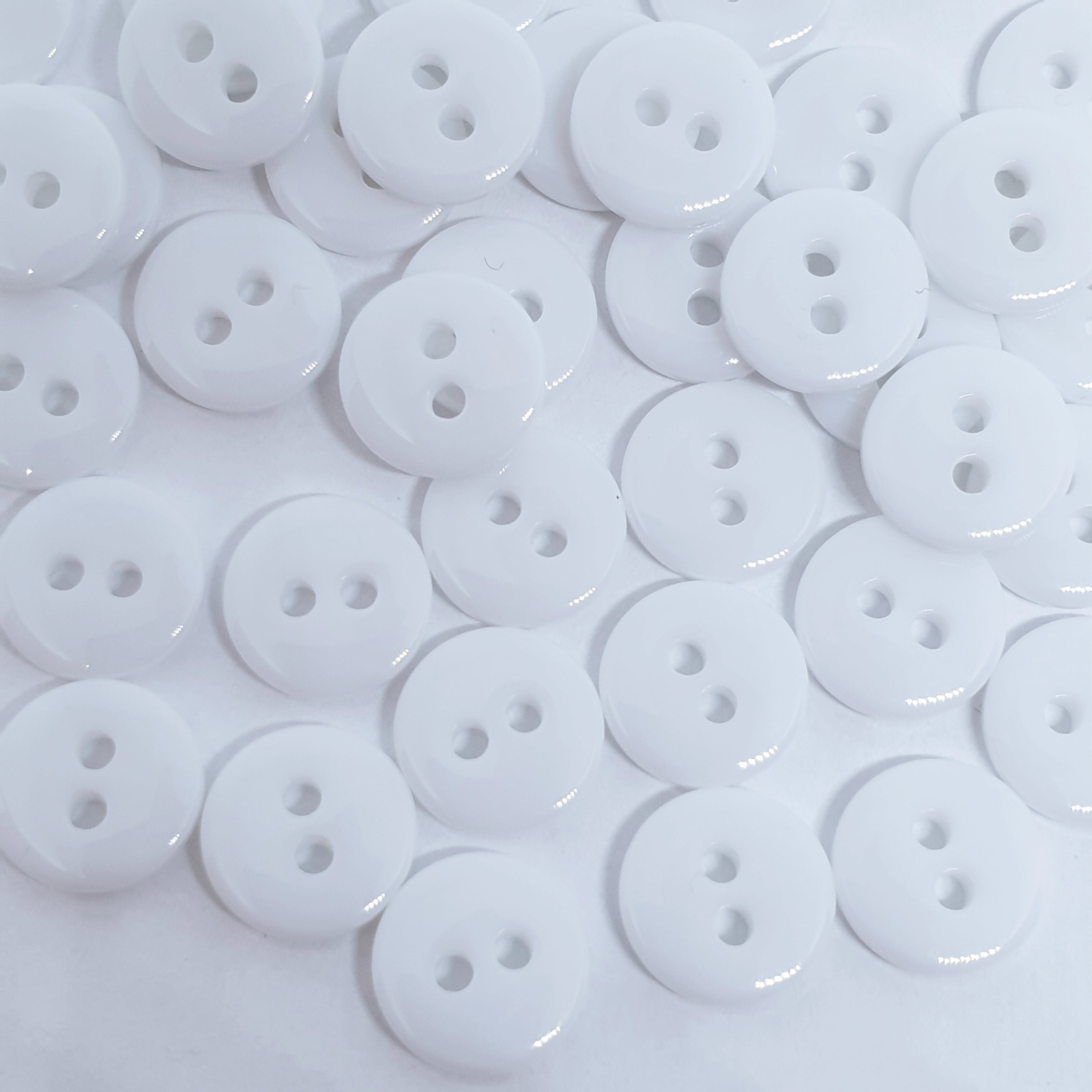 White top sewing buttons